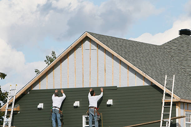 Professional Siding Installation technician working in Central Islip, NY